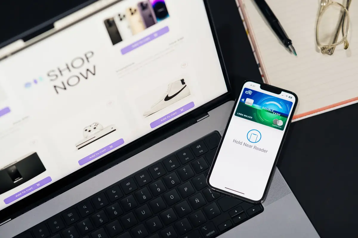Laptop and phone used together for online shopping