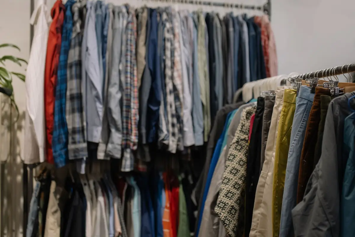 Secondhand clothes on racks in a thrift shop