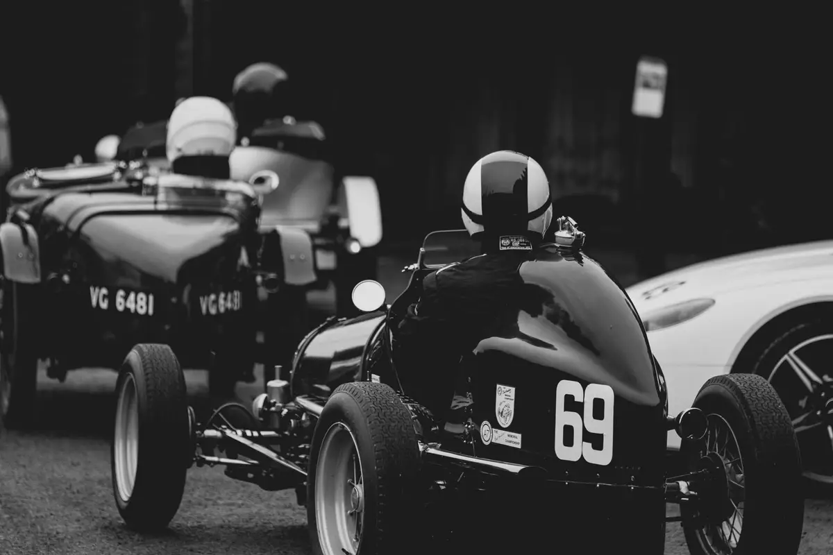 Black and white photo of vintage racing cars