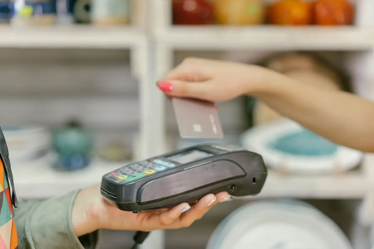Customer paying by card at a point-of-sale terminal