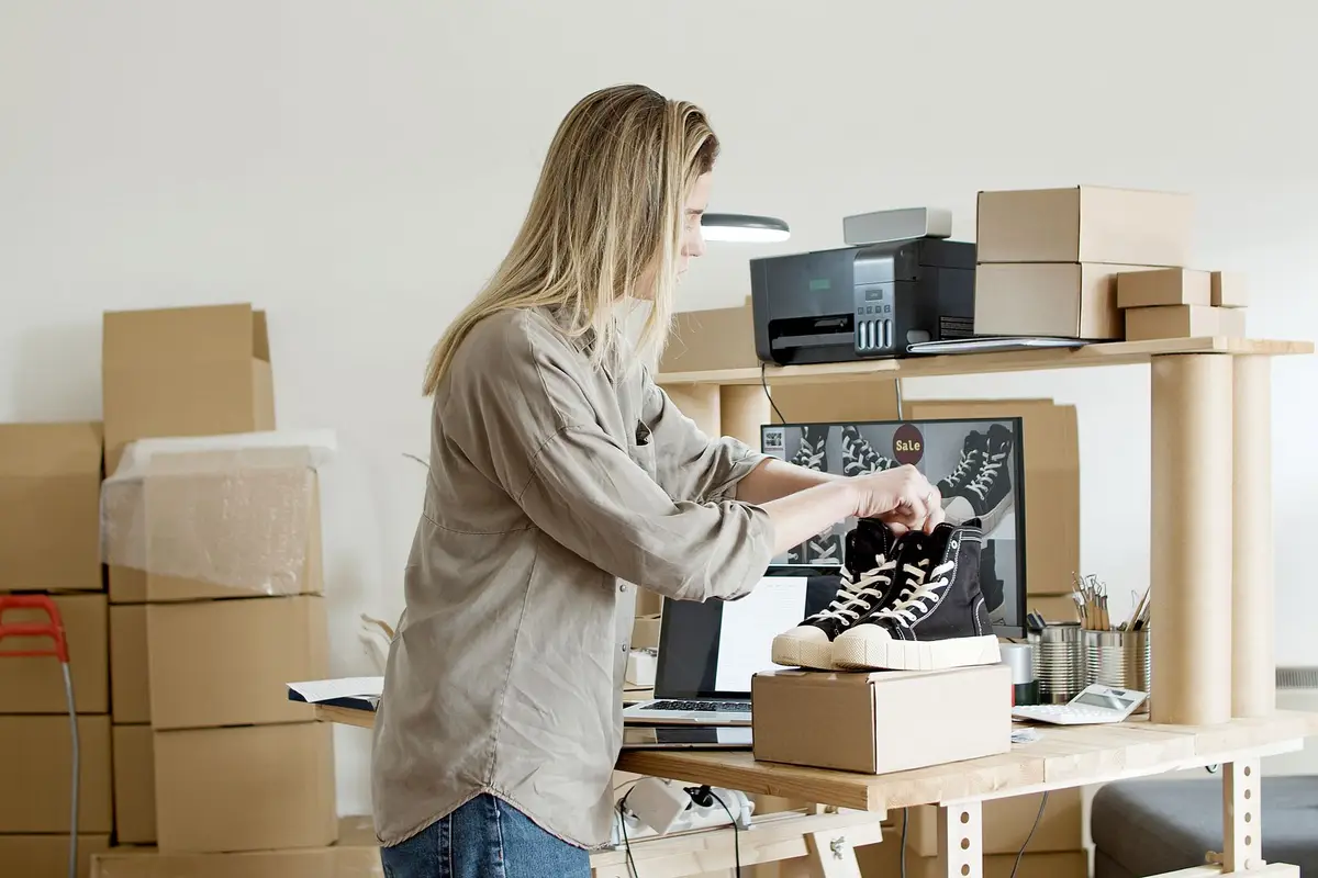 Seller packing an order at a workspace