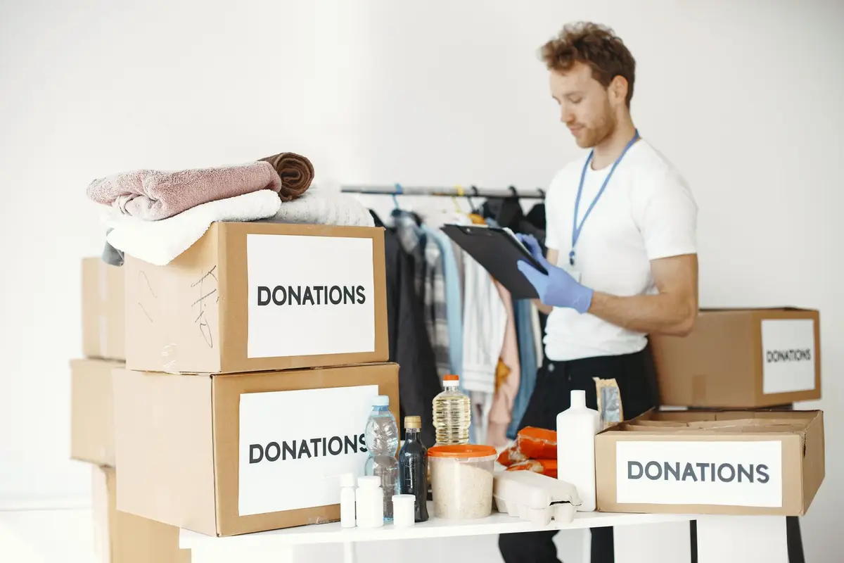 Volunteer sorting donated goods