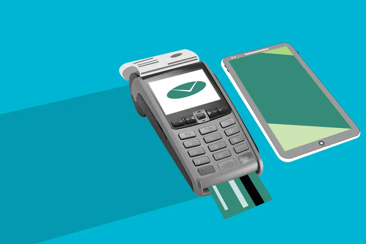 Paper cut-out of a card terminal and credit card