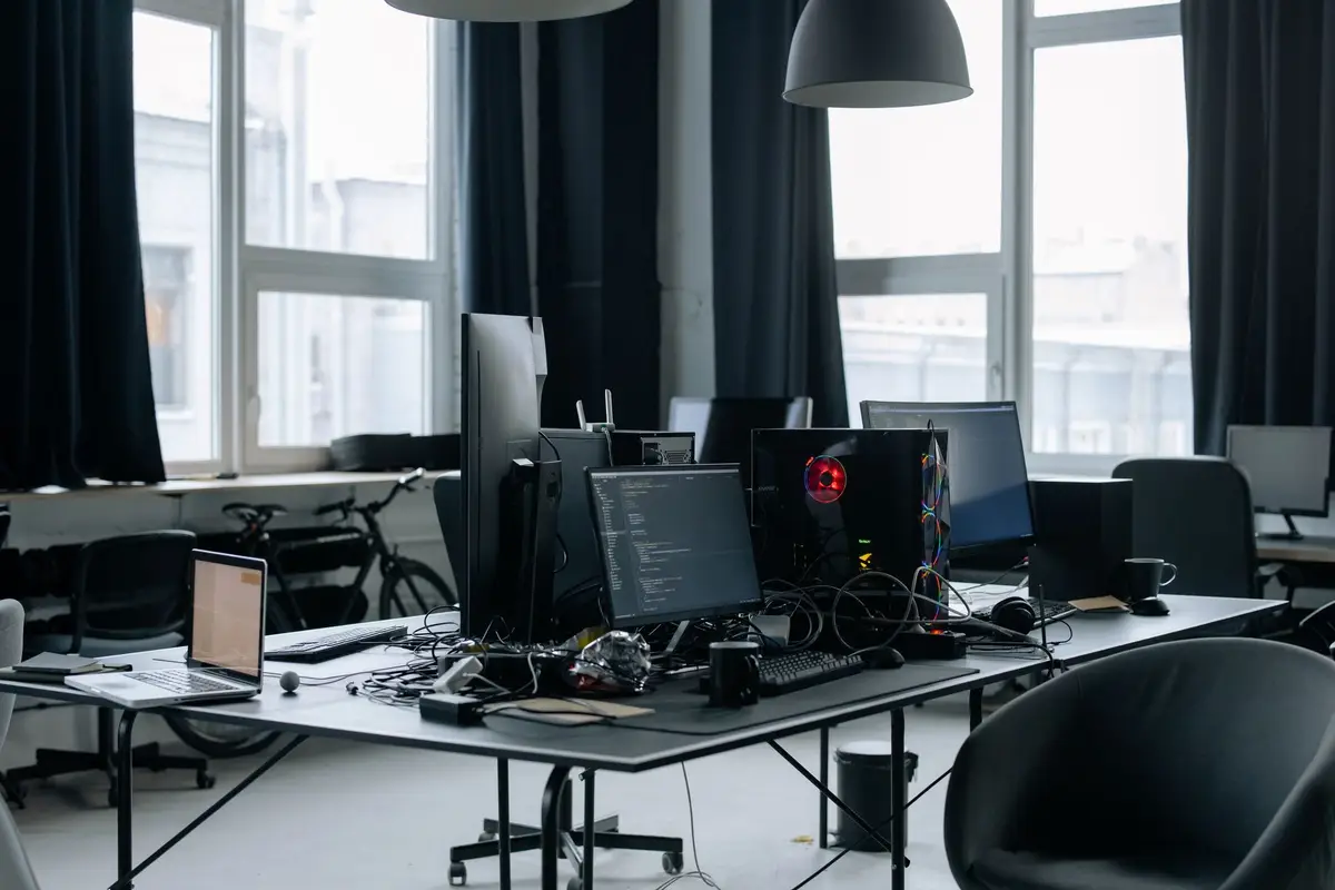 Modern office with screens showing code