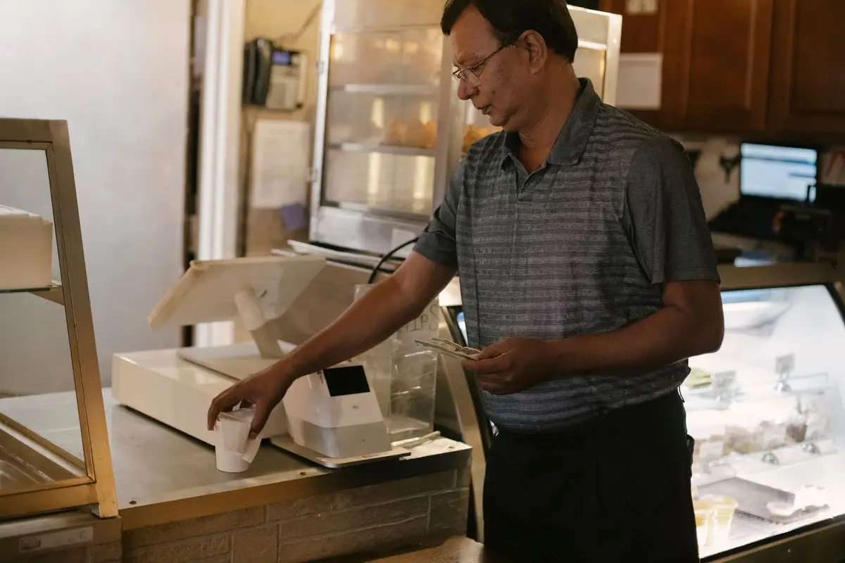 Customer paying at a shop counter