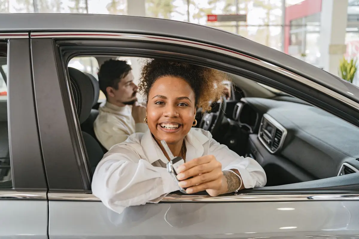 Couple holding new car keys
