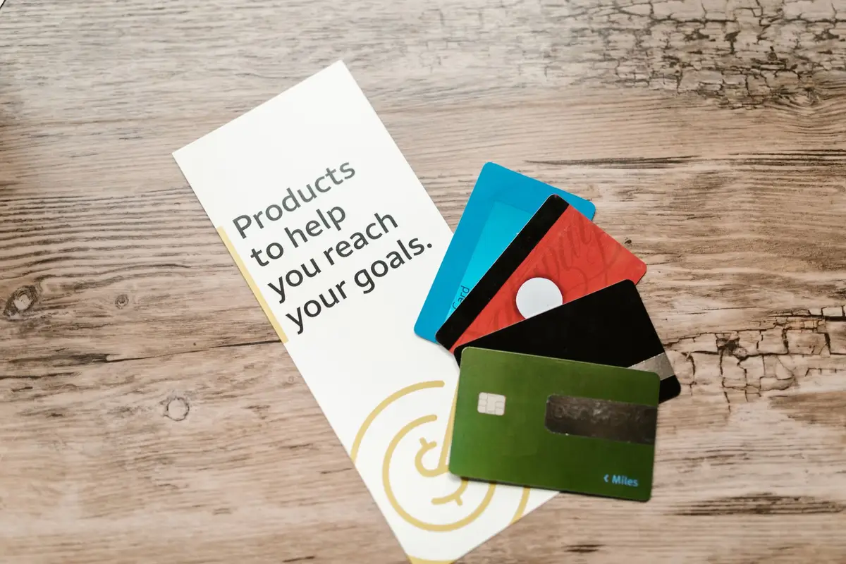Credit and debit cards on a wooden table