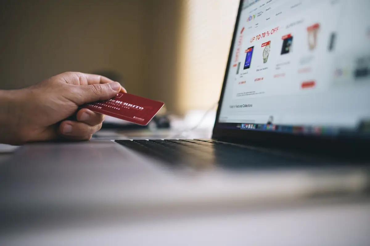 Person shopping online with a credit card
